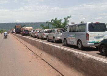 PHOTOS: Commuters trapped on flooded Abuja-Lokoja road