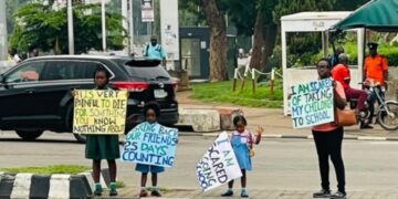 VIDEO: Abuja mother, three children stage protest over abducted Oyo pupils, teachers and principal
